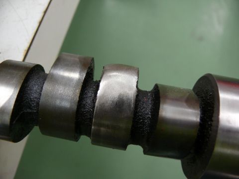1968 Chevrolet Camaro - A camshaft part is shown in detail, with visible wear on its lobes.