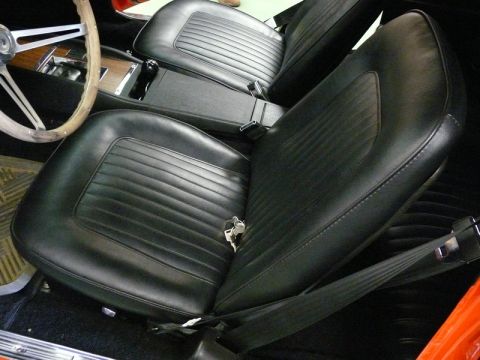 1968 Chevrolet Camaro - Interior view of a 1968 Chevrolet Camaro, highlighting the black vinyl bucket seats and center console.