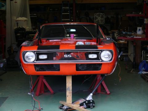 1968 Chevrolet Camaro - Front view of a 1968 Chevrolet Camaro SS undergoing work in a garage.