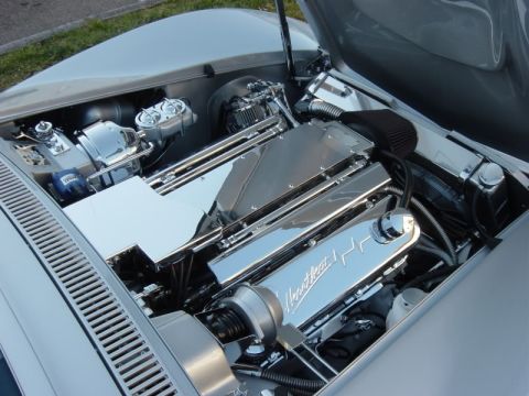 1976 Chevrolet Corvette - Engine bay features polished chrome components and 'Heartbeat' branded valve covers.