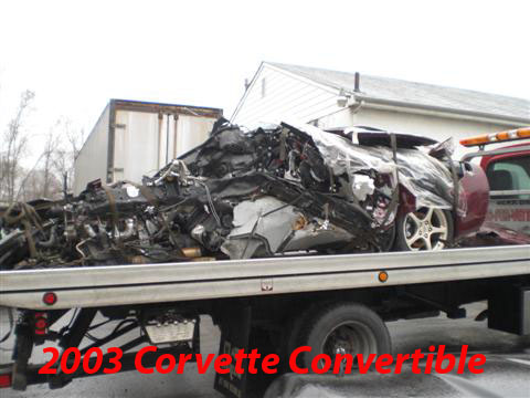 1976 Chevrolet Corvette - A severely damaged 2003 Chevrolet Corvette is loaded onto a tow truck after an accident.