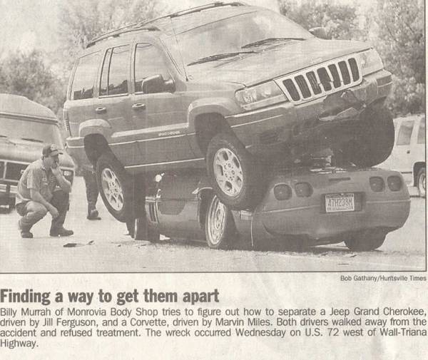 Jeep Grand Cherokee resting on the rear of a Chevrolet Corvette after an accident. A man kneels nearby
