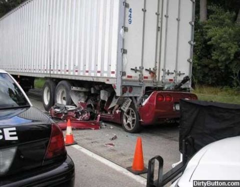 1976 Chevrolet Corvette - A red Corvette's rear end is severely damaged after colliding with the back of a semi-trailer.