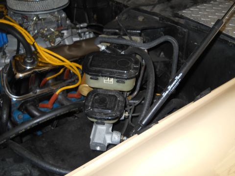 1976 Ford Bronco - Close-up view of the engine bay, showing brake components and wiring.