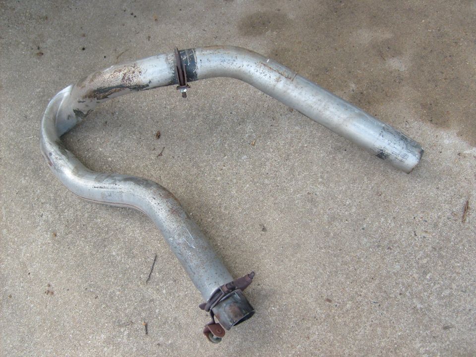 Bent exhaust pipe on concrete