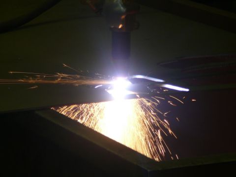 1988 Ford Bronco - A plasma cutter is used to cut metal, generating a shower of sparks.