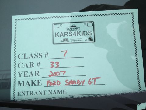 2007 Ford Mustang - Photograph of a handwritten car show dash entry card for a 2007 Ford Shelby GT.