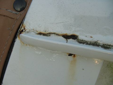 1992 Ford Bronco - passenger side rain gutter and cracks. you can clearly see the rust bubbling up underneath the paint.