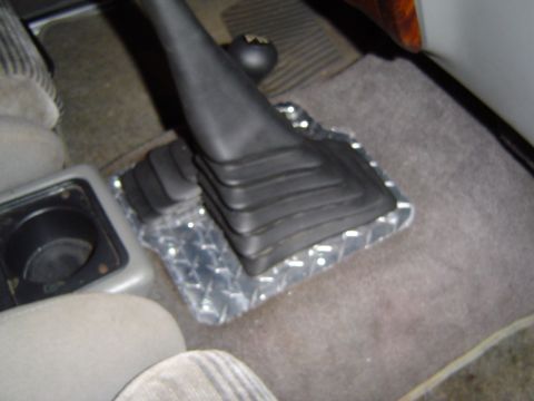 1989 Ford Ranger - Close-up of a shift boot and floor mat inside a vehicle.