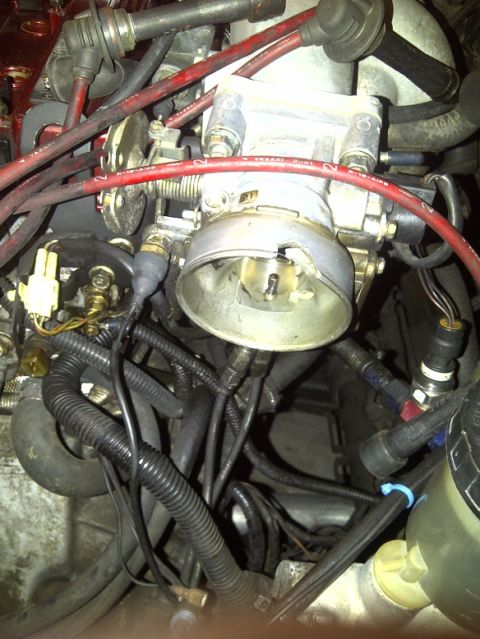 1995 Ford Probe - Close-up view of a vehicle's engine bay, showing various components and wiring.