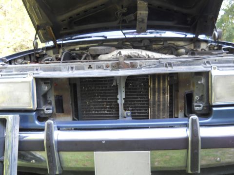 1992 Ford Bronco - Front view of a 1992 Ford Bronco's engine compartment, hood is up.