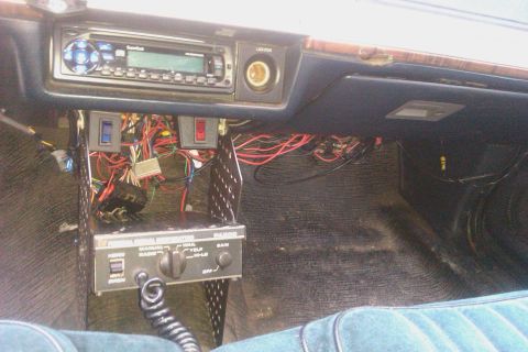 1991 Ford LTD Crown Victoria - Aftermarket stereo and CB radio installation with visible wiring under the dashboard.