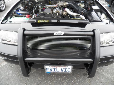 2003 Ford Crown Victoria - Crown Victoria nose with black brush guard, billet grille and EVIL VIC vanity plate.