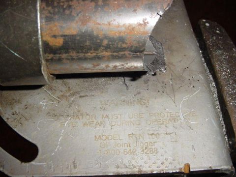1992 Ford Bronco - A close-up view of a metal component with operational warnings and model information.