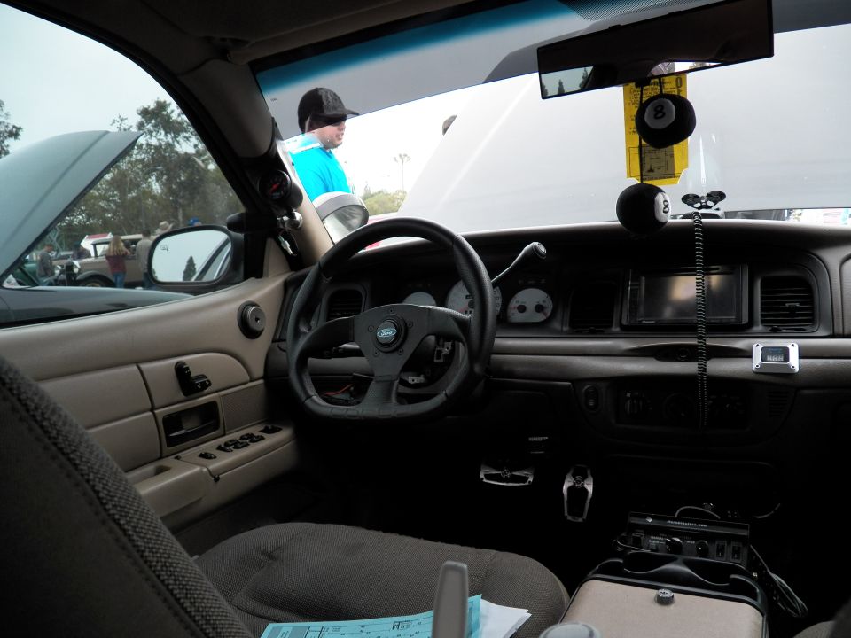 Crown Victoria interior with aftermarket steering wheel and 8-ball shifter, Ford emblem