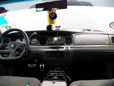 2003 Ford Crown Victoria - Wide interior shot of a Ford sedan dash, custom wheel, floor shifter and hanging 8-ball.