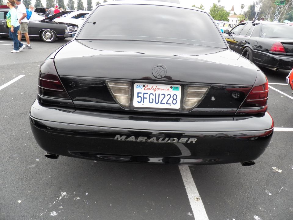 Rear of black Mercury Marauder sedan with California plate 5FGU228 at car show
