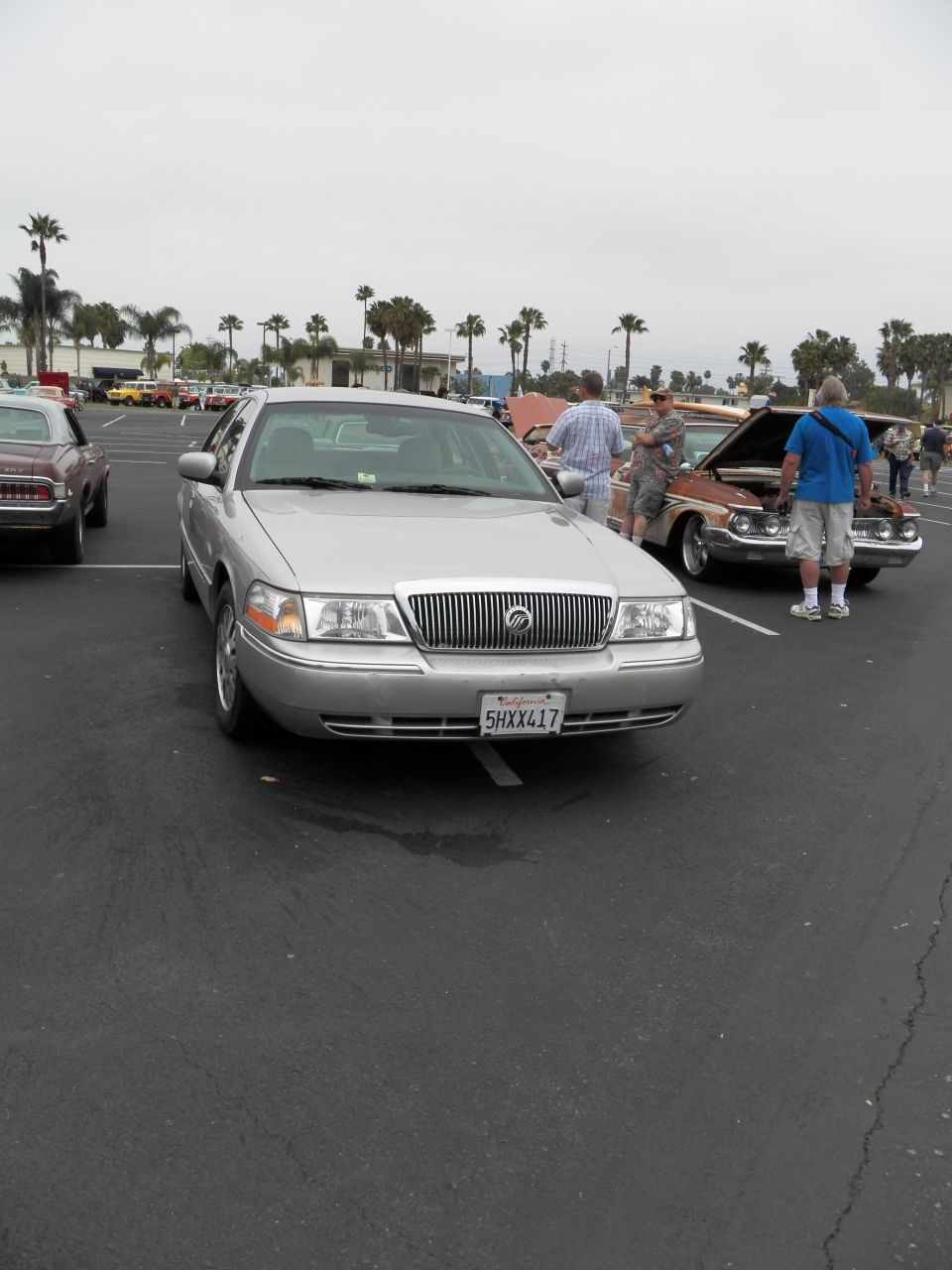 Silver Mercury Grand Marquis front view, plate 5HXX417, at outdoor car show