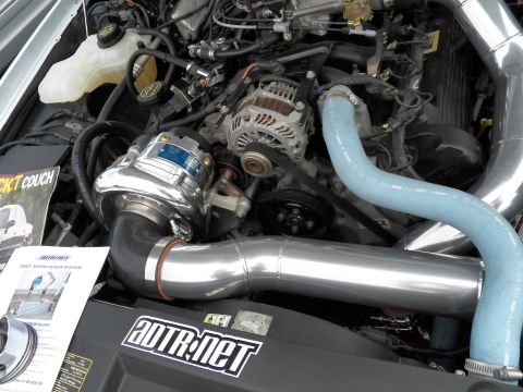 2003 Ford Crown Victoria - Polished centrifugal supercharger mounted to a V8, blue hose and intake tube over an ADTR.net cover