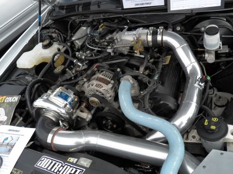2003 Ford Crown Victoria - Engine detail showing chrome intake piping, alternator and centrifugal supercharger on a V8