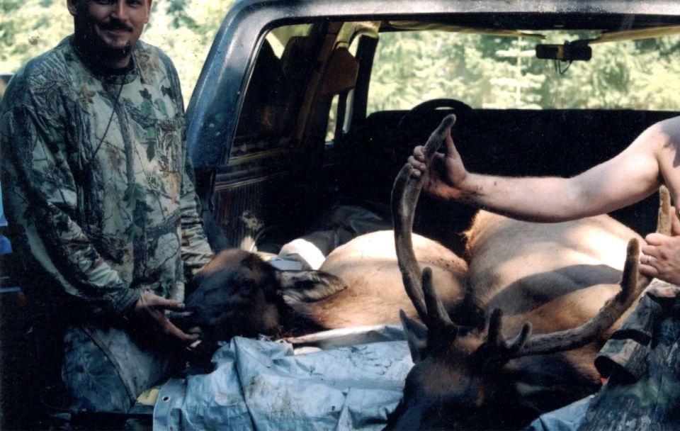 This is my freinds 4 point bull and my elk that as best as we can figure we shot them at the same time, but we were a few miles away from each other. Look at that Two Elk in my Bronco cant beat that one.