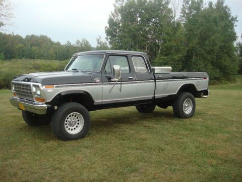1979 Ford F-350 - This 1979 Ford F-350 pickup truck is shown in a three-quarter front view, highlighting its two-tone black and silver paint scheme.