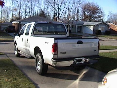 2004 Ford F-250 - This 2004 Ford F-250 Super Duty pickup truck is seen from the rear three-quarter angle.