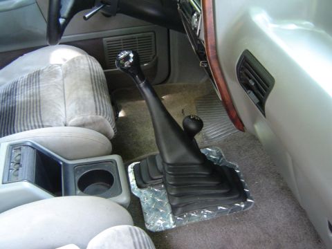 1989 Ford Ranger - Interior view of a 1989 Ford Ranger, focusing on the manual transmission shifter and its diamond plate base.