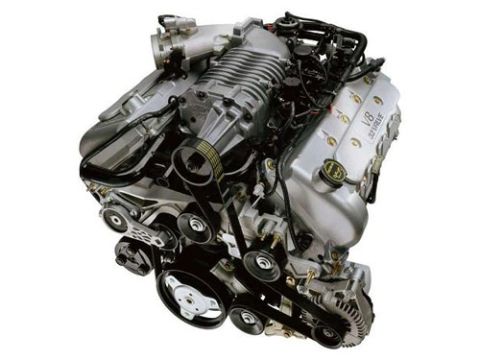 2004 Ford Crown Victoria - A supercharged V8 engine is shown with "V8 32 VALVE" visible on the silver valve cover.