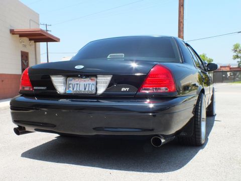 2003 Ford Crown Victoria - Straight-on rear of Crown Vic, EVTL VIC plate, Crown Victoria and SVT badges.