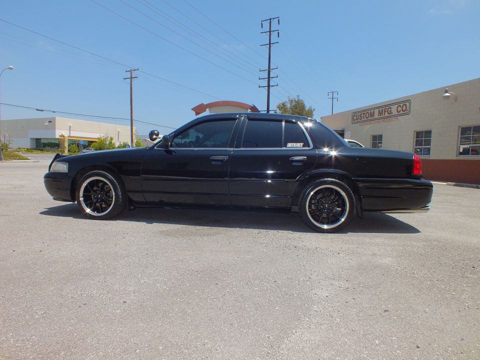 Black Crown Victoria full side profile on black wheels by Custom Mfg Co