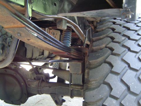 1989 Ford Ranger - Rear suspension components and a large off-road tire are visible in this close-up shot.
