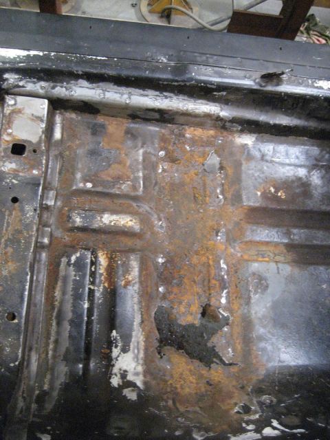 1973 Ford Ranchero - This vehicle's floor pan is in rough shape, with extensive rust damage visible.