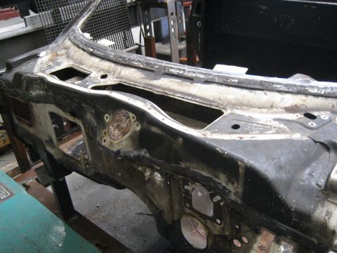 1973 Ford Ranchero - This image shows the firewall of a vehicle undergoing restoration, with visible rust and damage.