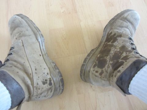 1997 Dodge 3500 - These work boots appear to be stained with oil, suggesting a possible leak from a vehicle's interior.