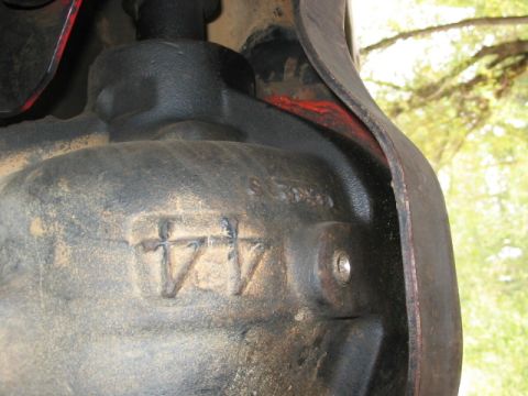 1991 Ford Bronco - Cast metal component with stamped markings, possibly from a vehicle's drivetrain.
