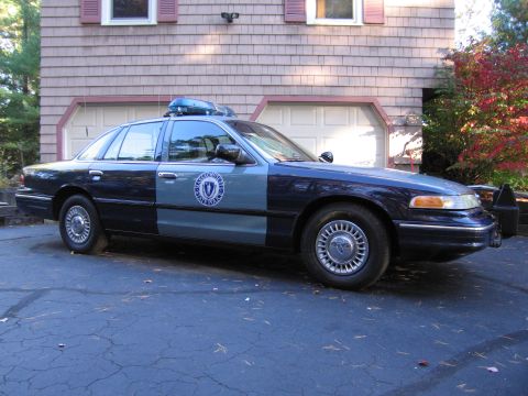 2001 Ford Crown Victoria - Side view of a two-tone blue and grey Massachusetts State Police Ford Crown Victoria.