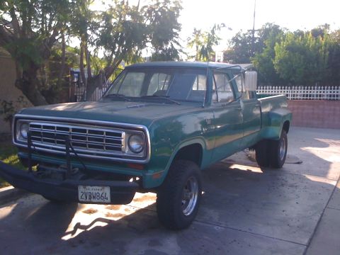 1968 Ford Mustang - This green dually pickup truck features a prominent aftermarket bumper and dual rear wheels, suggesting it may be used for heavy-duty tasks.