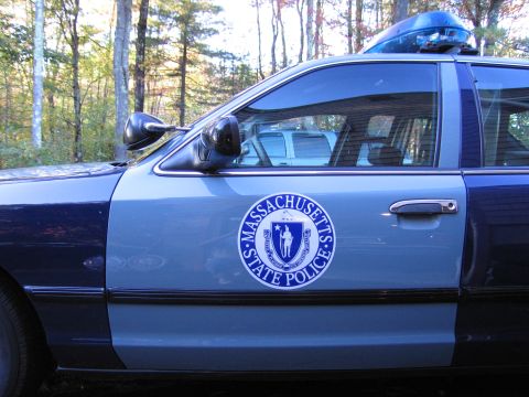 2001 Ford Crown Victoria - A Massachusetts State Police Ford Crown Victoria is parked outdoors, showing its side profile and official seal.