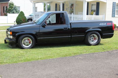 1990 Chevrolet Silverado 1500 - This black 1990 Chevrolet Silverado 1500 features prominent 454 SS badging on the rear fender.