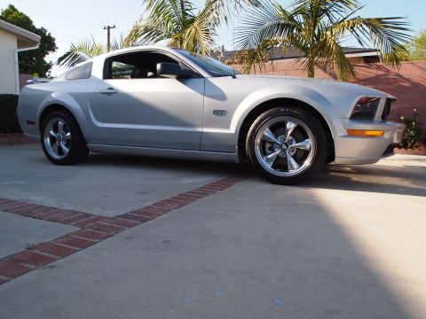 1994 Ford Bronco - This silver 2005 Ford Mustang GT coupe is shown from a three-quarter front view.