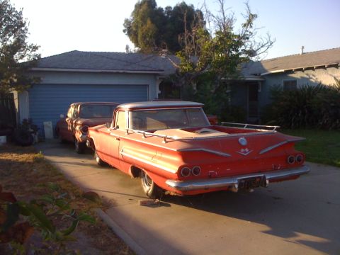 1968 Ford Mustang - A red 1959 Chevrolet El Camino pickup truck is parked in a driveway with another car behind it.