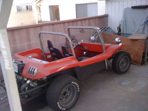 1968 Ford Mustang - This dune buggy has a roll cage and bucket seats, and is parked outside.
