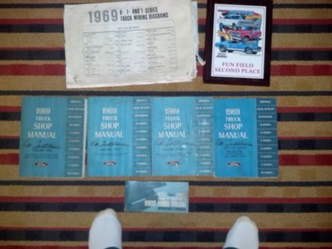 1969 Ford F-250 - Collection of 1969 Ford F-Series truck shop manuals and wiring diagrams displayed on a striped carpet.