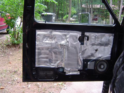 1989 Ford Ranger - Car door interior showing sound deadening material and a speaker installation.