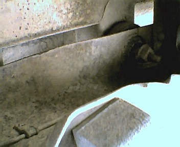 1985 Ford Bronco - Detail of the vehicle's structural frame and suspension components.