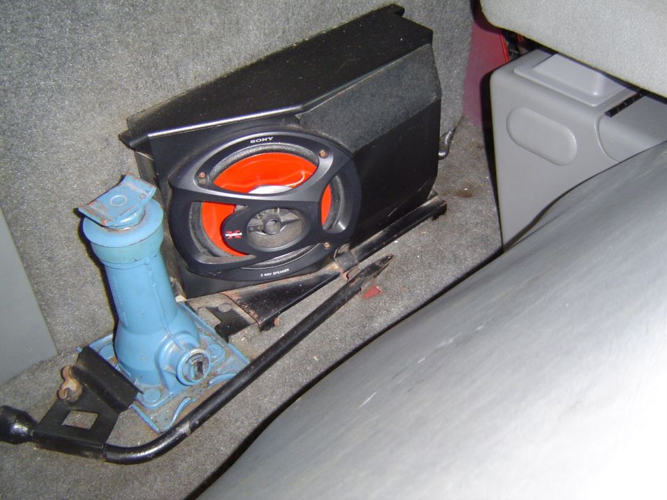 car interior with a Sony speaker and a blue jack on the floor