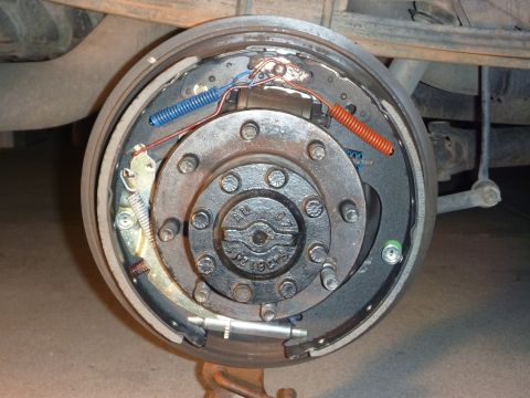 1997 Dodge 2500 - Close-up view of a vehicle's drum brake assembly, showing the brake shoes, springs, and hub.