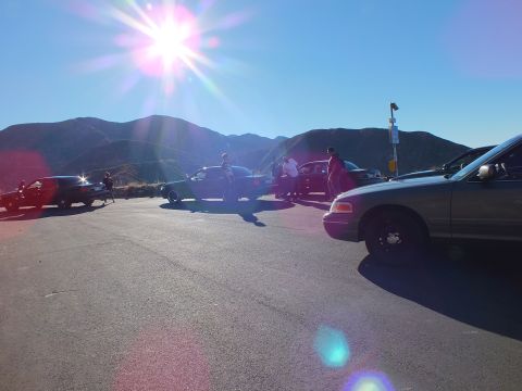 2003 Ford Crown Victoria - Close silver Panther sedan body with a backlit hilltop meet behind it