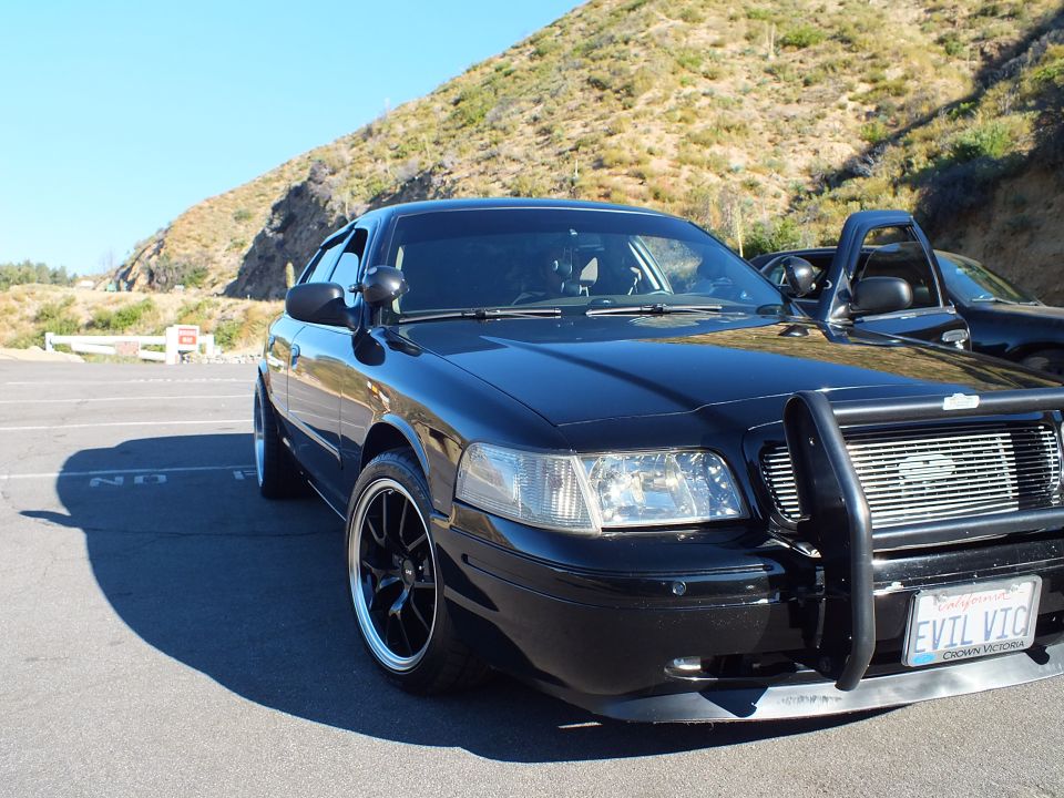 Black Ford Crown Victoria with grille guard and EVIL VIC California license plate